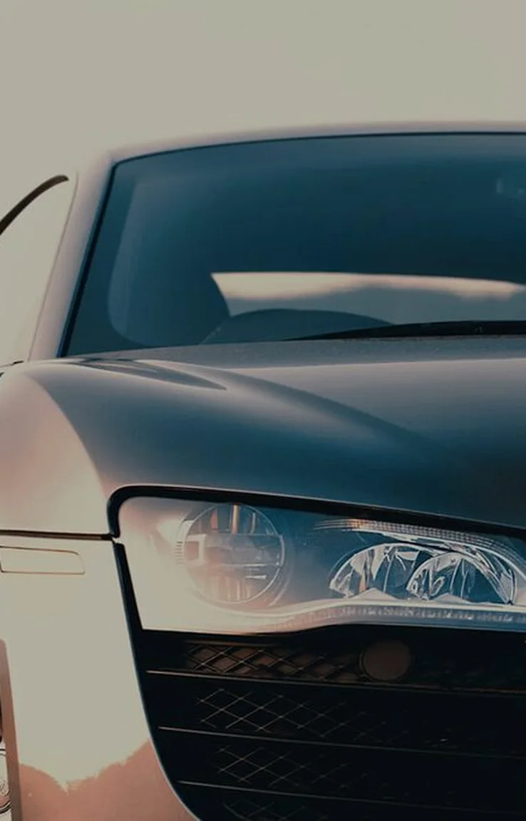 Performance car front end at dusk