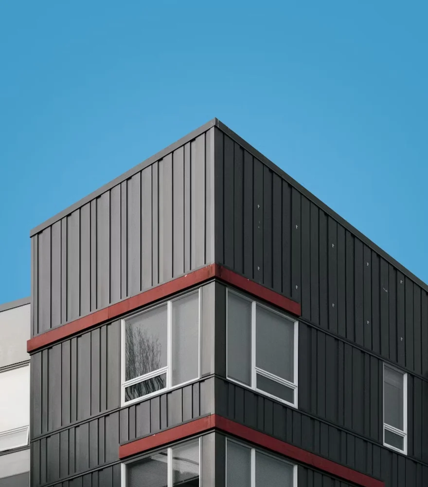 Modern architectural building exterior against a clear blue sky