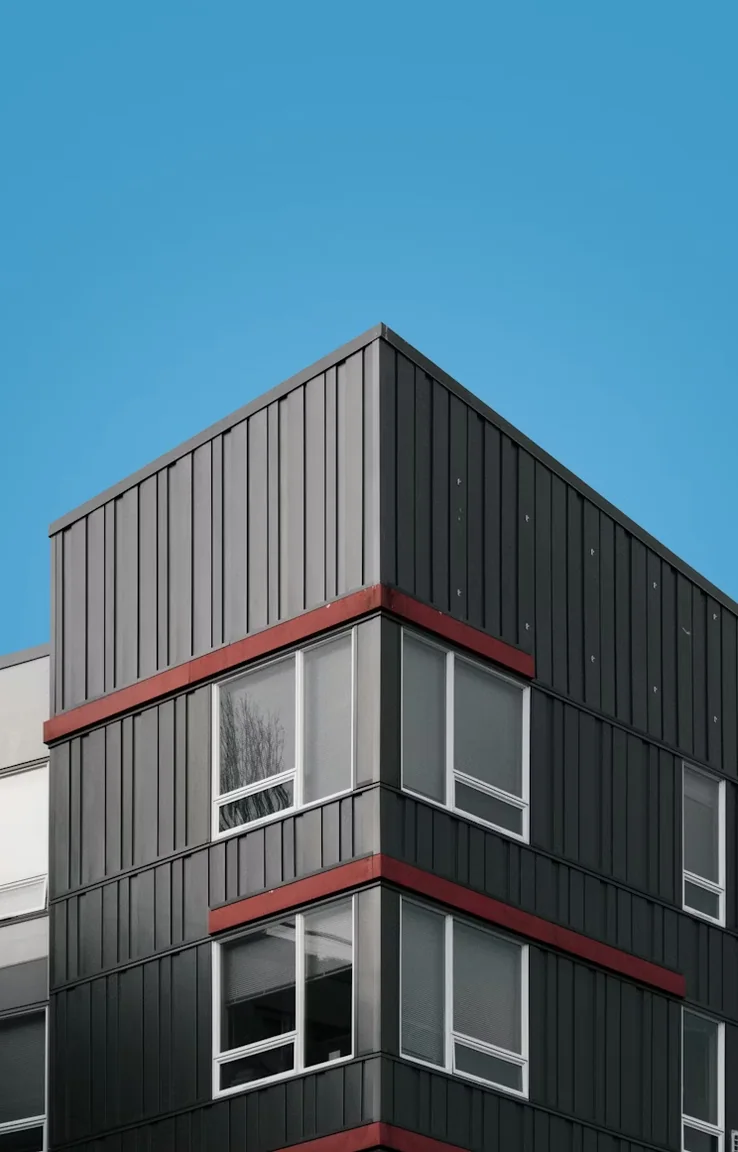 Modern architectural building exterior against a clear blue sky